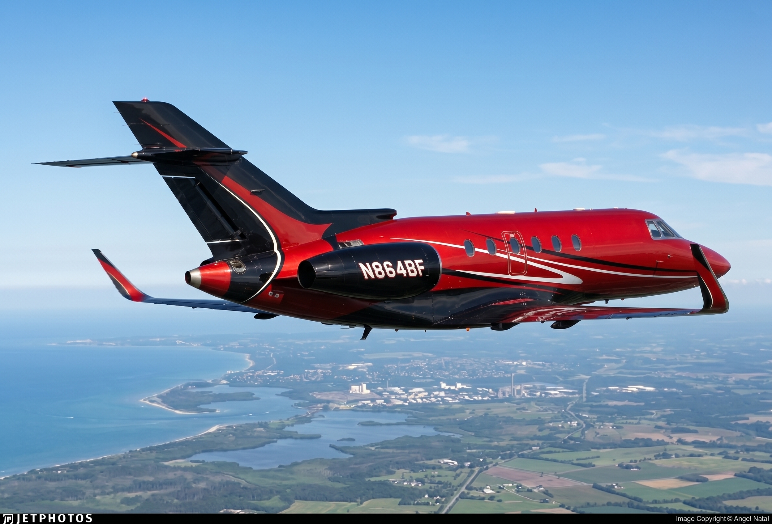 Side profile of N864BF in flight